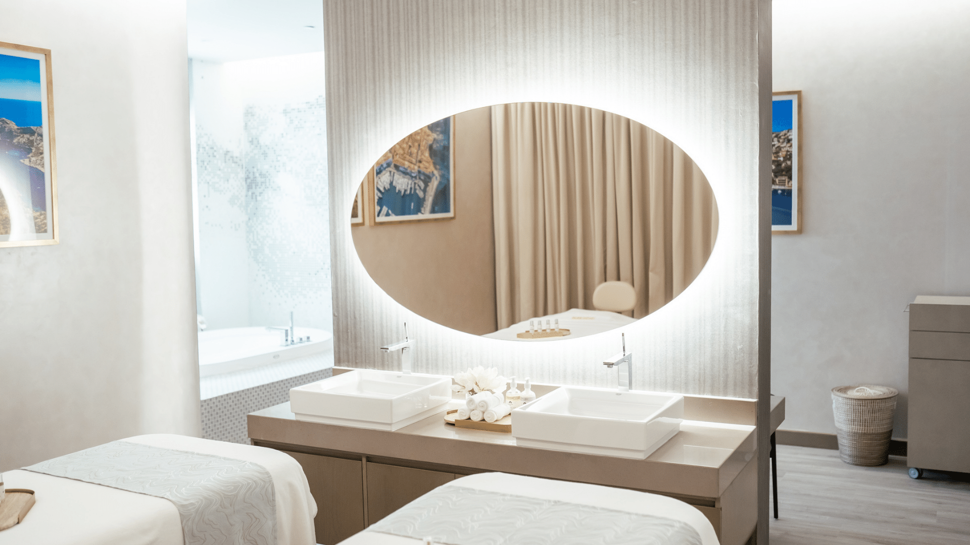Spa treatment room with twin beds and a large illuminated mirror at Paramount Hotel Midtown