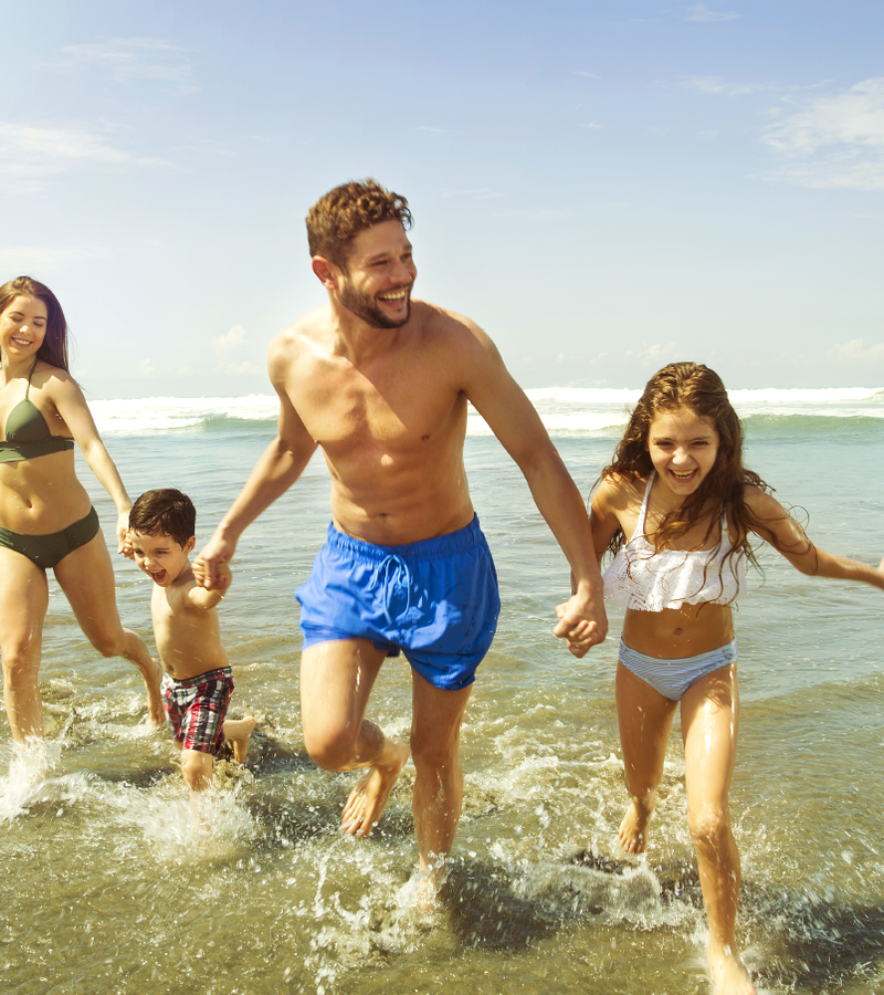 A family enjoying at the beach in Mundo Imperial