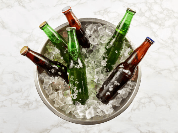 Close-up of beer bottles in an ice bucket at Gamma Hotels
