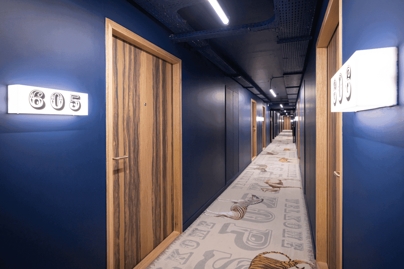 Hallway with blue interior at Kopster Hotel Paris Ouest Colombes
