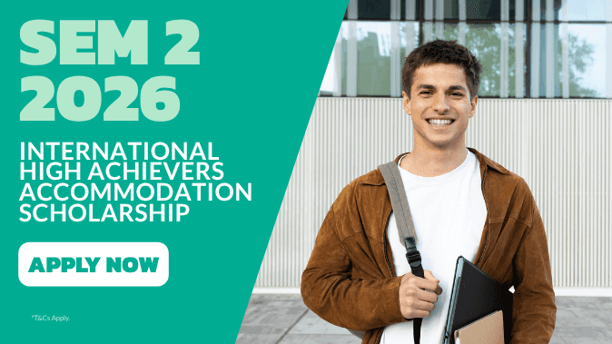 Smiling student with backpack and laptop standing outside modern building for International High Achievers Accommodation Scholarship.