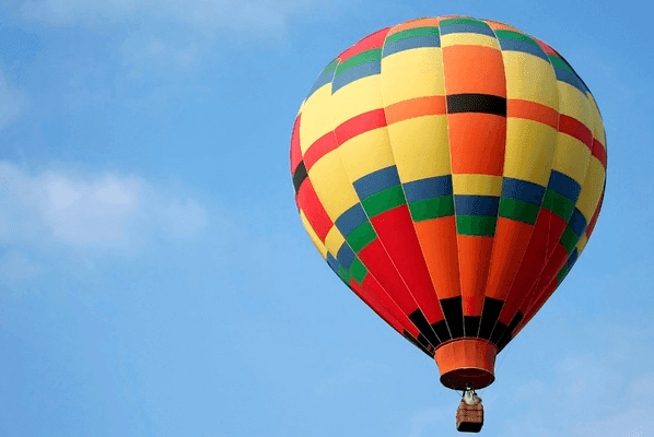 Hot-air balloon gliding through the sky near Lake Buena Vista Resort Village & Spa