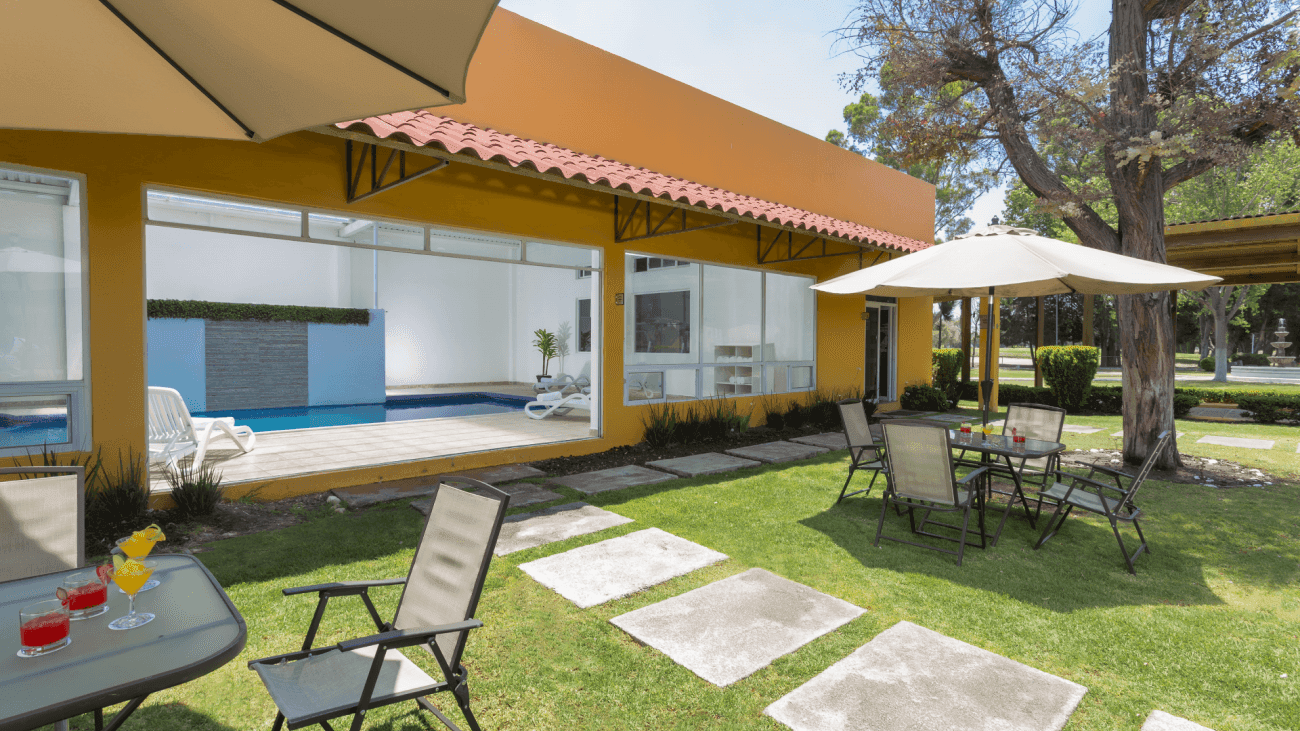 Exterior seating area of interior pool at Gamma Pachuca