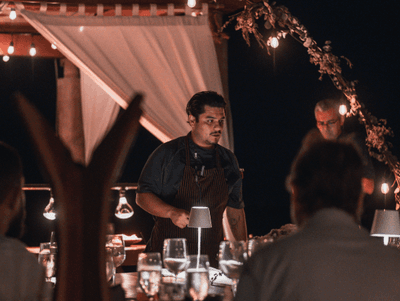 Couple enjoying romantic candlelit dinner at Villa Premiere Hotel Boutique and Romantic Beach Resort Puerto Vallarta