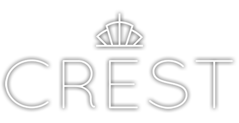 The official logo of Crest Hotel & Suites in white