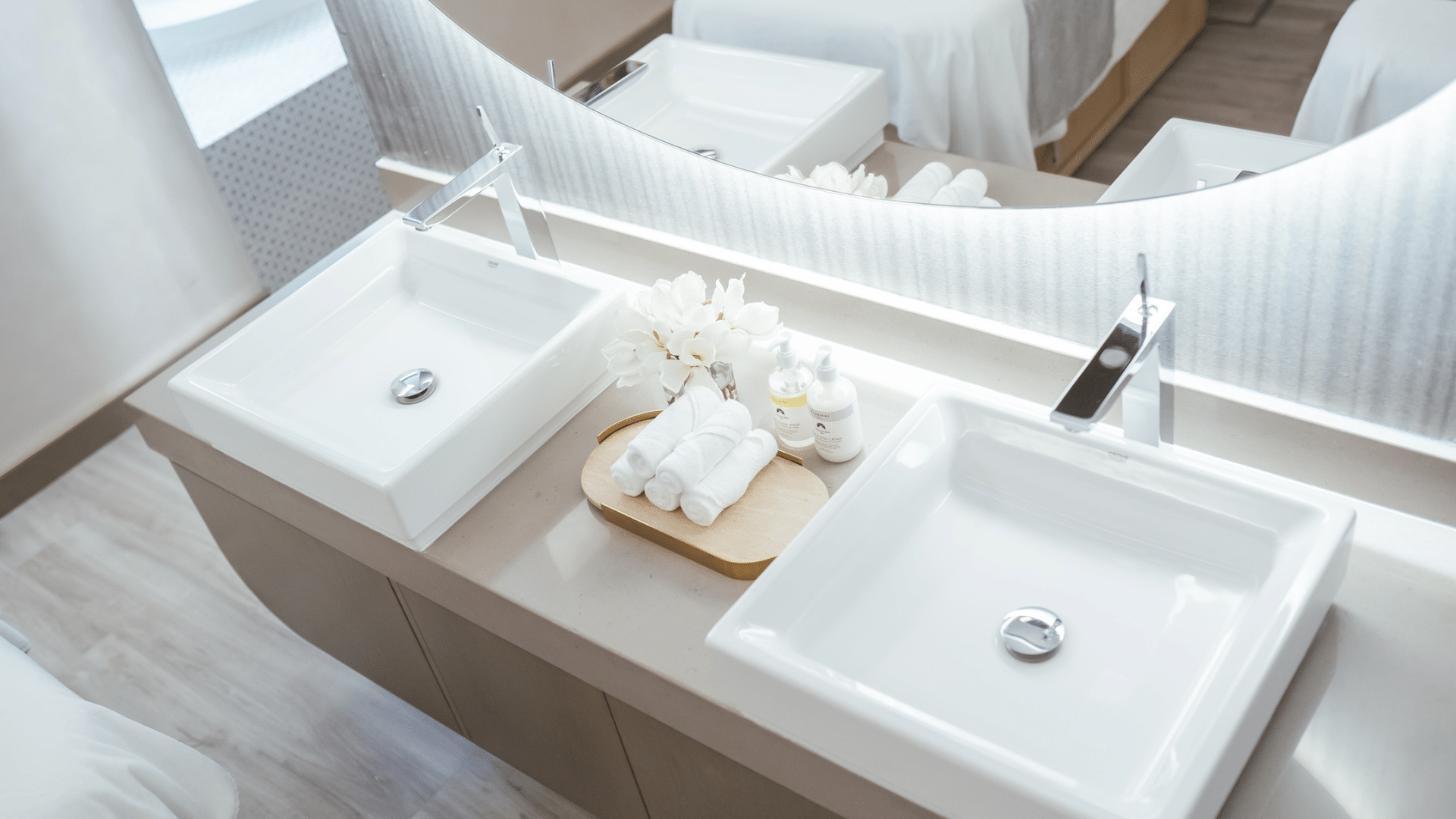 Vanity area with amenities and a large illuminated mirror in the Pause Spa at Paramount Hotel Midtown