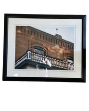 Wall art of an old building with black frame at Hotel 43