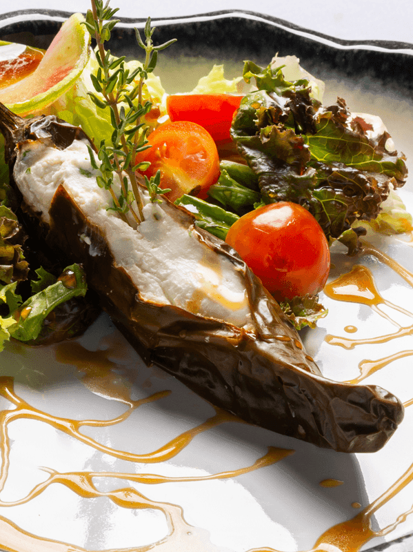 Close-up of Eggplant Parmigiana dish served on a plate in Corazón Contento at Buenaventura Grand Hotel and Spa