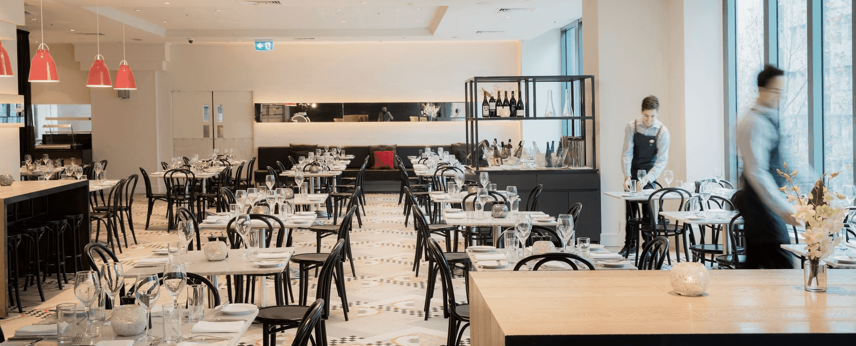 Waitress setting up table at Novotel Melbourne On Collins