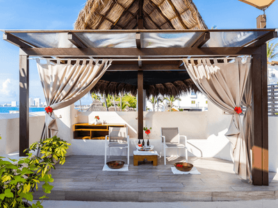 Cabana with curtains and seating area in Shakti Spa at Buenaventura Grand Hotel and Spa