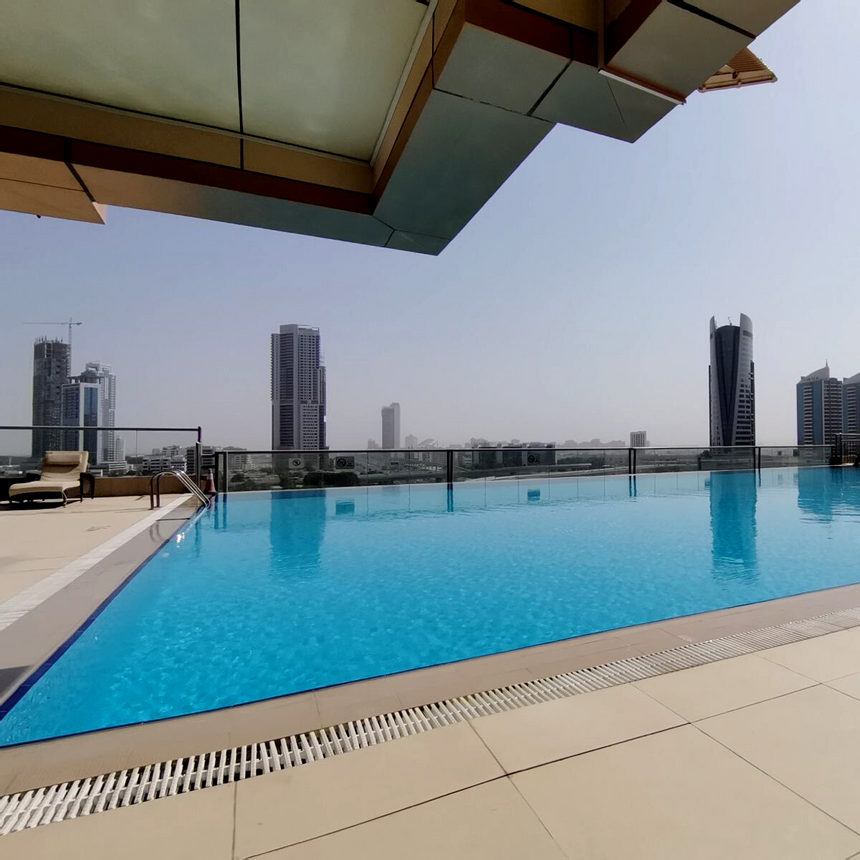 Rooftop pool area with city view at Two Seasons Hotel & Apt 