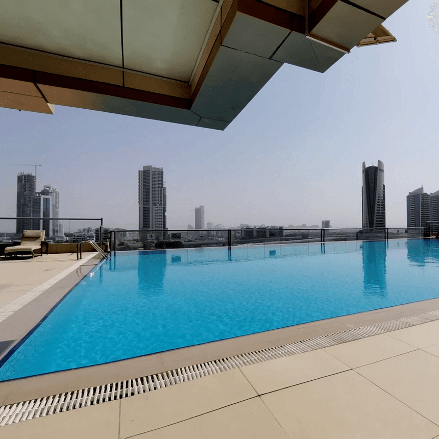 Rooftop pool area with city view at Two Seasons Hotel & Apt 