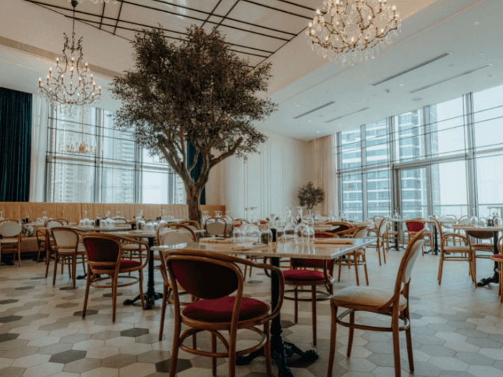 Dining tables arranged in Paparazzi Tuscan Restaurant at Paramount Hotel Midtown