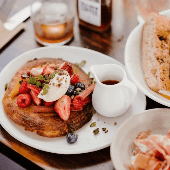 Pan cakes served with strawberries and blue berries at Nesuto Parramatta Apartment Hotel