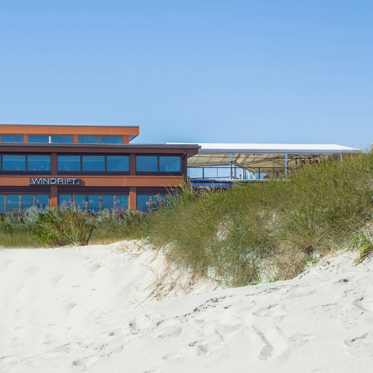 Exterior view of ICONA Hotel Windrift from the beach