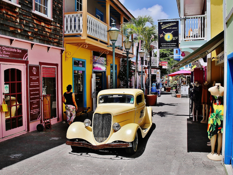 Classic car parked on street near The Morgan Resort Spa Village