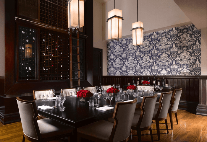 Dining table set with floral decor for a formal meal at Diplomat Beach Resort