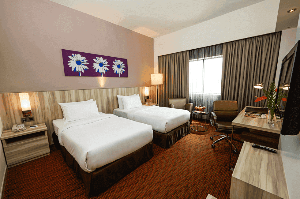 Twin beds, work space and a single sofa in Premier Twin Room at Sunway Hotel Seberang Jaya