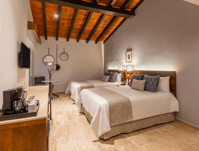 Deluxe Two Double Beds with TV and coffee station at Buenaventura Grand Hotel and Spa
