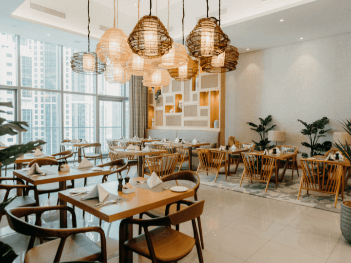 Dining tables arranged in CineScope Restaurant at Paramount Hotel Midtown