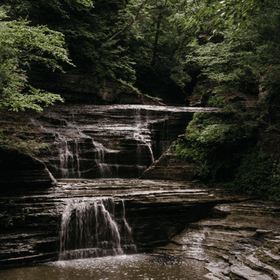 Cascading water and rocky gorge of Buttermilk Falls State Park in Ithaca near La Tourelle Hotel and Spa