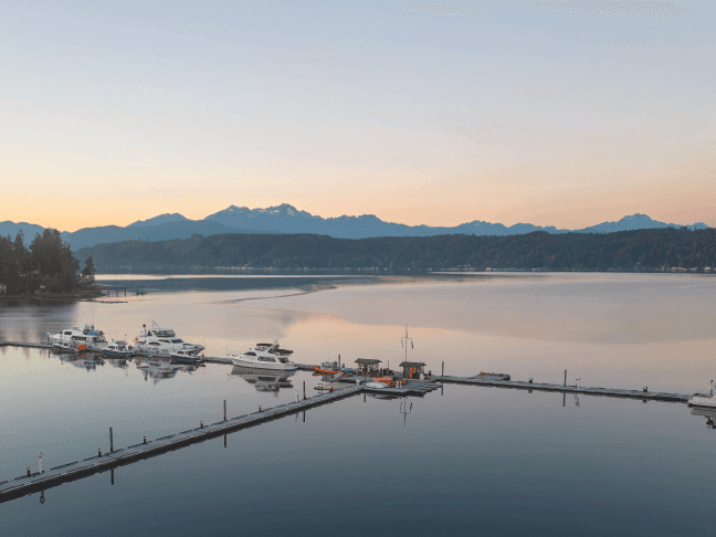 Boats are securely docked at a lakeside dock near Alderbrook Resort & Spa