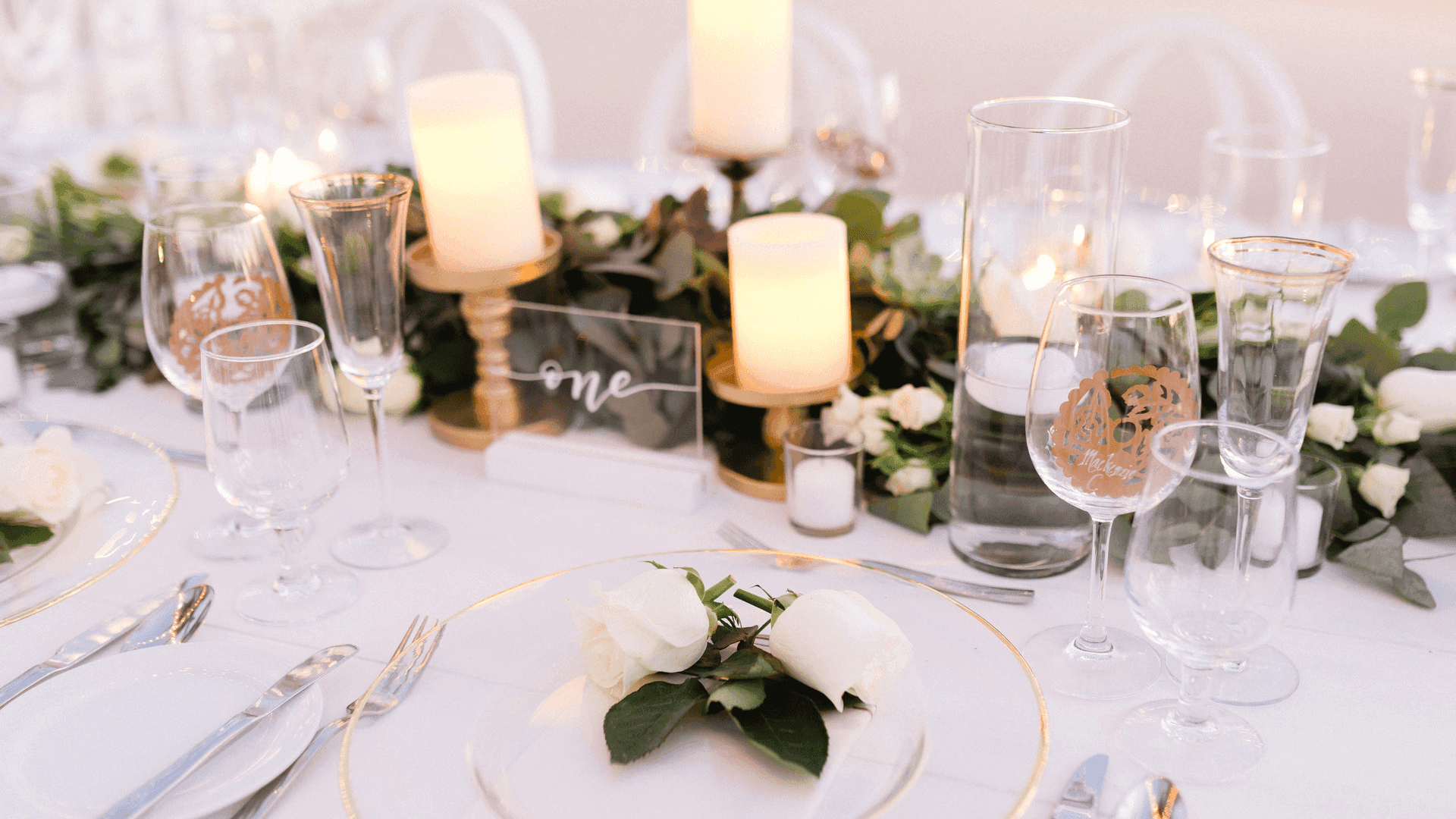 Table with glasses, candles & flowers at Fiesta Americana