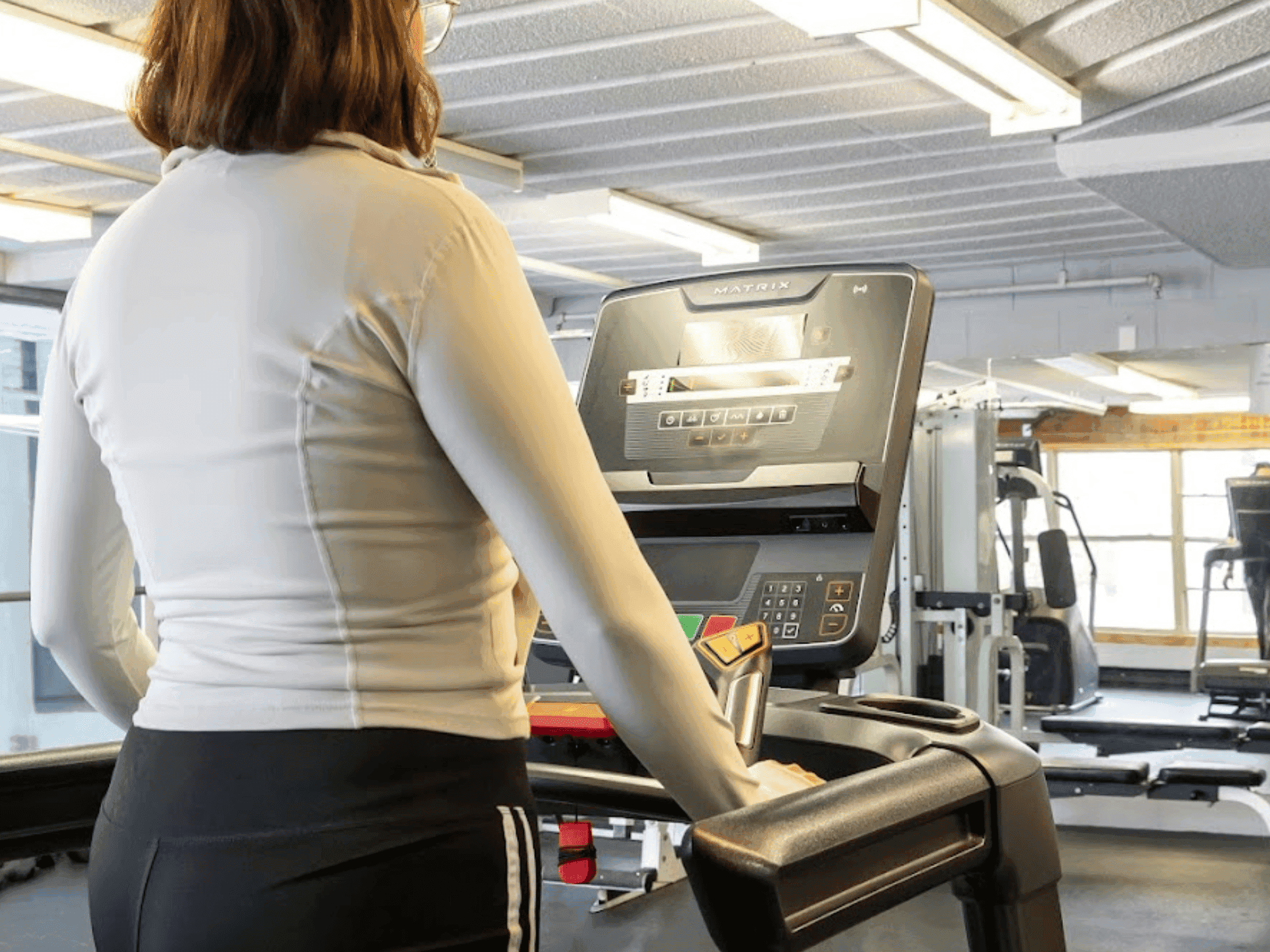 Woman using a cardio machine in the fitness center at Rodd Grand Yarmouth, one of the top hotels with a gym in Yarmouth