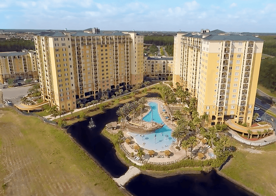 Aerial view of a resort with a pool and water feature.