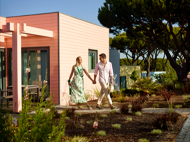 A couple walking in the garden at The Magnolia Hotel