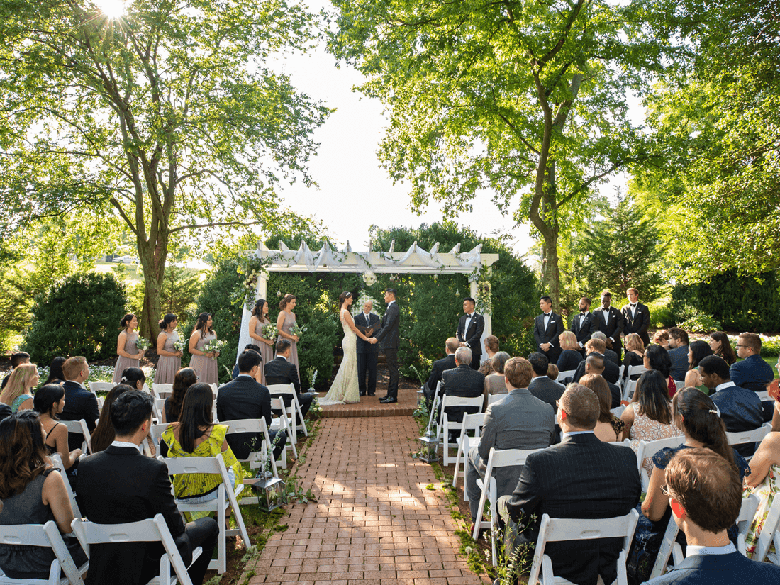 Virginia outdoor wedding at Boxwood Garden, Inn at Willow Grove, with bridal party under a canopy