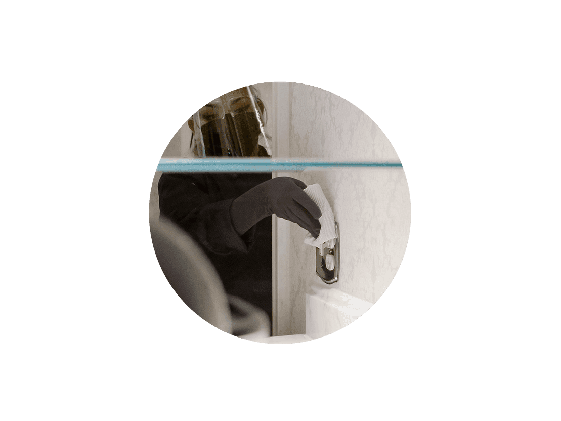 Bristol Hotel - Best Hotel Amenities - Advanced Covid Safety Cleaning protocol - woman with mask cleaning outlet with gloves