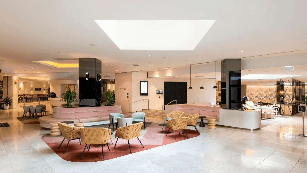 Stylish lobby with cozy seating and modern decor at Novotel Sydney International Airport
