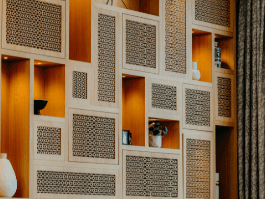 A wall with shelves and vases in CineScope Restaurant at Paramount Hotel Midtown