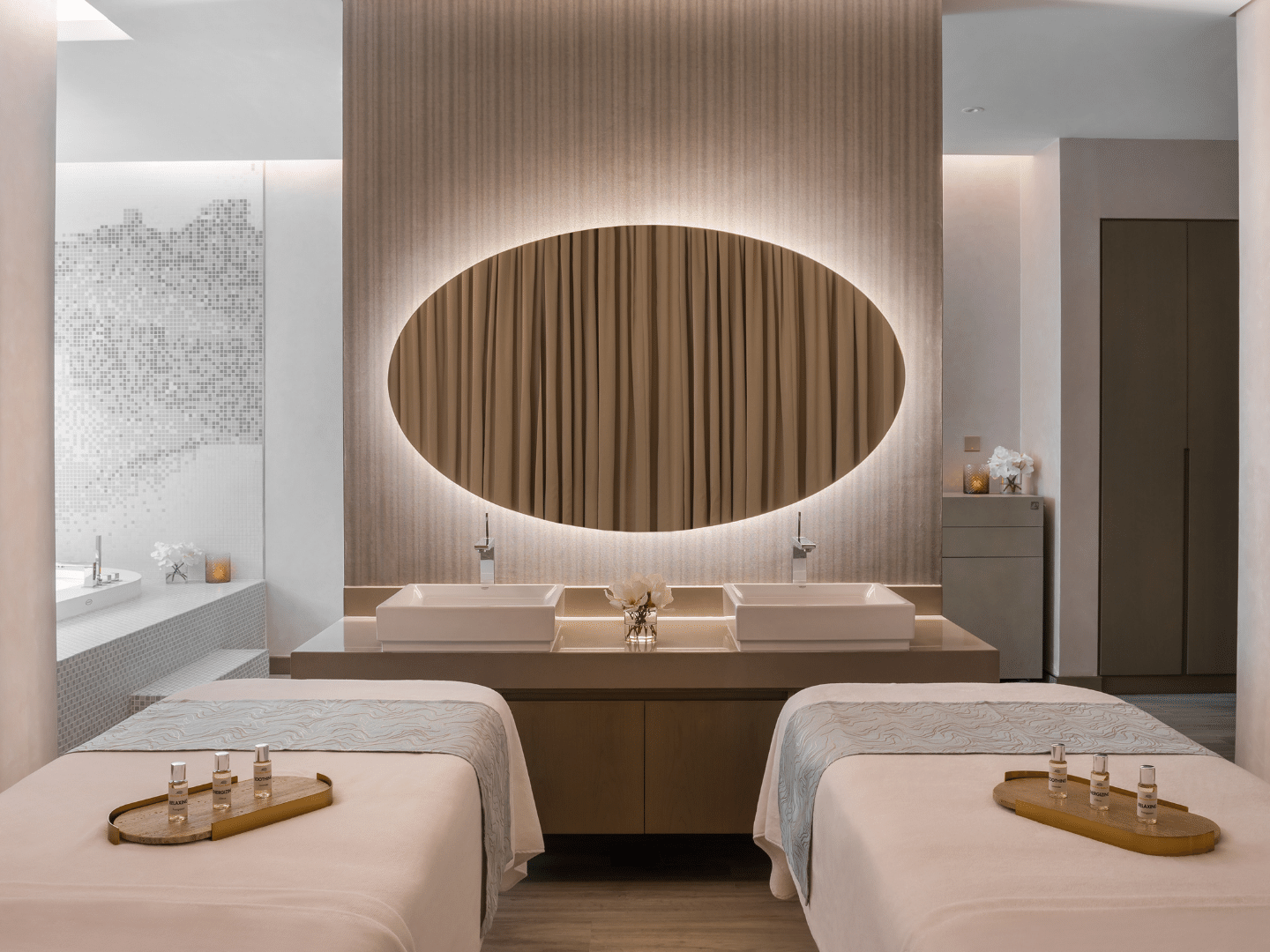 Beds, sink, mirror with amenities in Pause Spa Château Bergerat Paramount Hotel Midtown