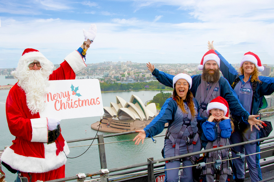 Family by Santa Clause overlooking city near Amora Hotel Sydney