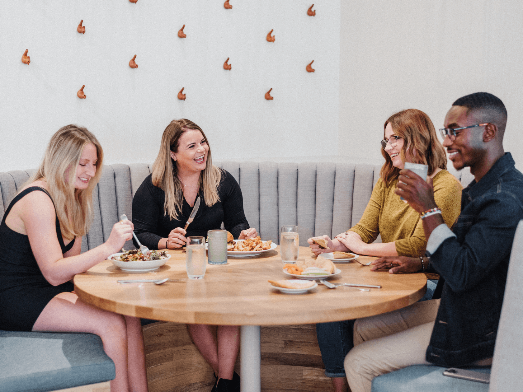 A group of firends enjojying cocktails in the bar.