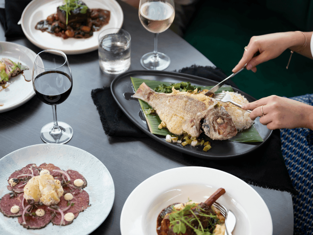 Fish, lamb shank and wine served at Pullman Magenta Shores