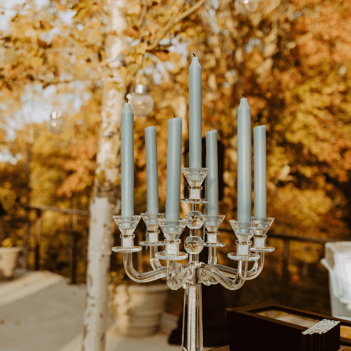 Candles set on a table for fall wedding