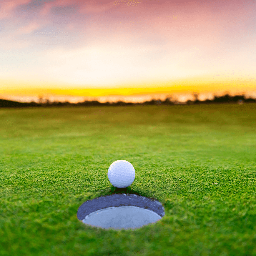 golf ball next to the hole at dusk Avalon NJ Golf Package, Golf Getaway in NJ