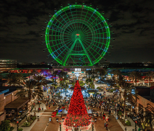 Kids posing in Santa Workshop Experience at ICON Park® near Lake Buena Vista Resort Village & Spa