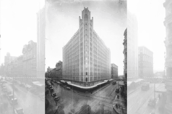 Vintage photo of the Grace Building, an Art Deco tower with classic cars parked below at The Grace Sydney