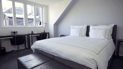Bed & desks in the Nest Room at The Sparrow Hotel