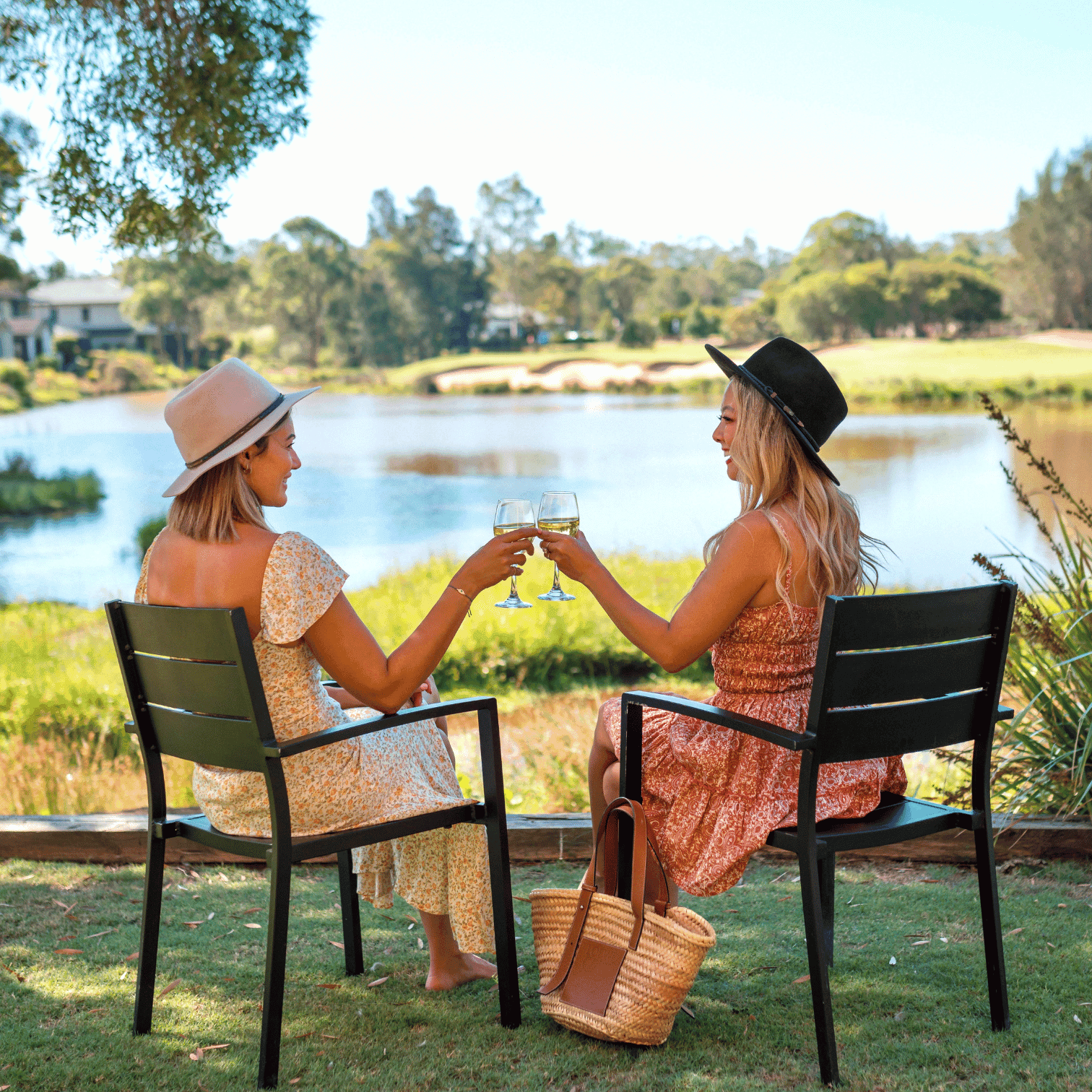 Locals offer voucher poster with ladies clicking glasses by the lake background at Mercure Kooindah Waters