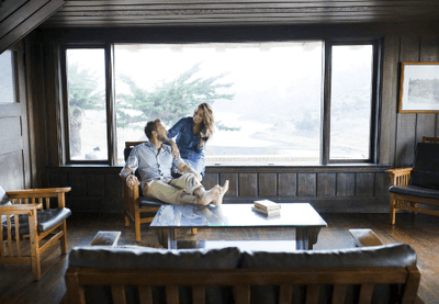 Couple enjoying a relaxing moment in a cabana lounge area with ocean view at Catalina Island Company
