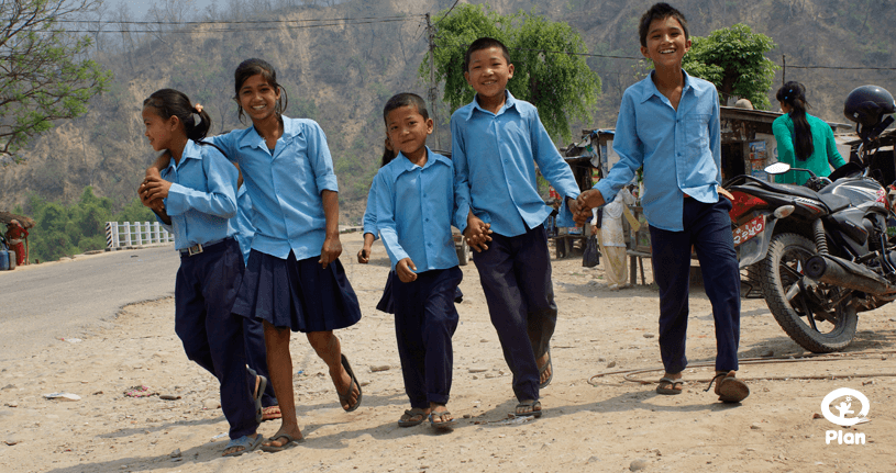 A group of kids on road.