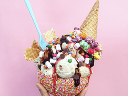 A deluxe ice cream sundae with sprinkles & candy topping near Bayside Inn Key Largo