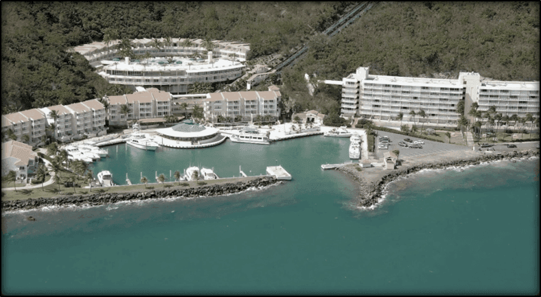 Vintage photograph of the EL Conquistador Resort with the ocean and lush greenery in October 1993
