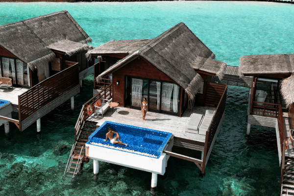A couple at over water villa at Grand Park Kodhipparu Maldives