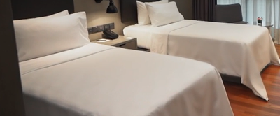 Twin beds in Studio Executive at VE Hotel & Residence